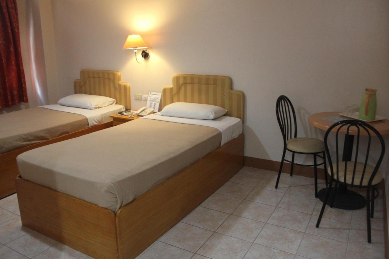 Elegant Circle Inn Cebu Værelse billede
